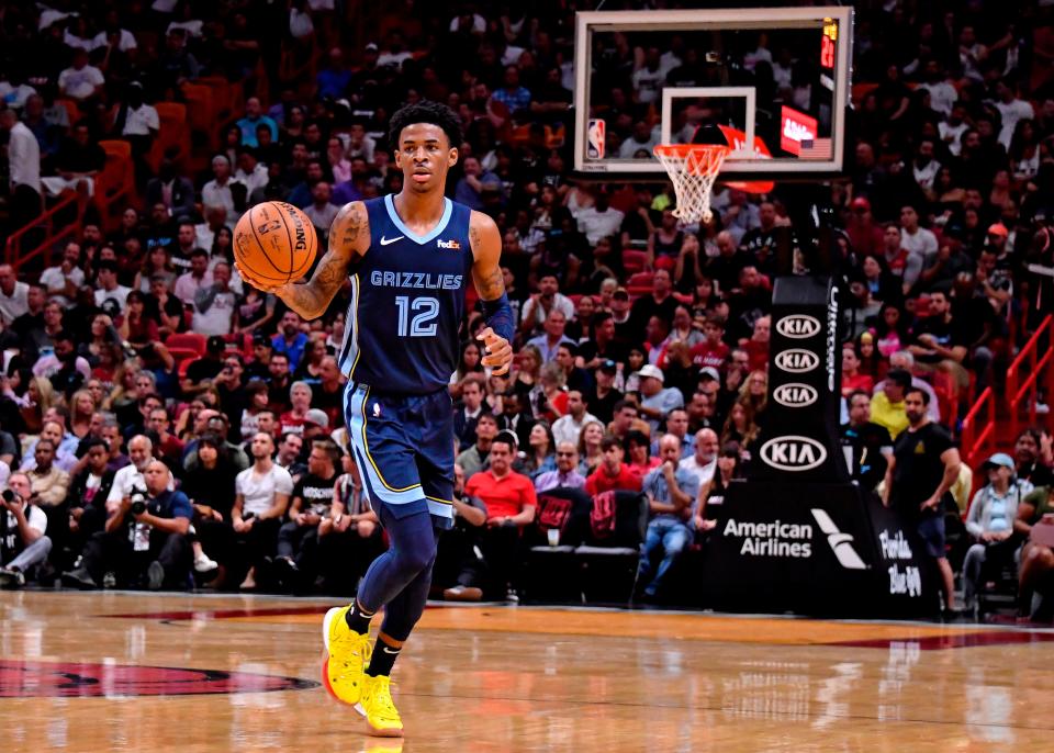 Grizzlies guard Ja Morant (12) dribbles the ball against the Miami Heat during the first half at American Airlines Arena in Miami on Wednesday, Oct 23, 2019.