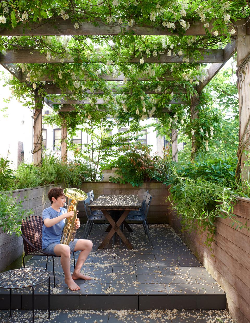 Jason Schmidt and Cory Jacobs’s son, Jules, joins the 7 p.m. cheering for essential workers from the family’s Brooklyn deck, designed by <a href="https://www.mabbottseidel.com/">Mabbott Seidel</a> Architecture.