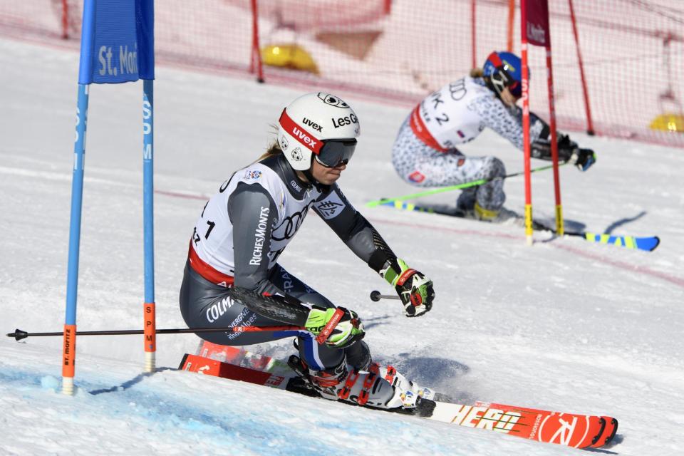 France's Adeline Baud Mugnier, left, in action against Slovakia's Veronika Velez Zuzulova, right, during the final parallel race in the team event at the 2017 Alpine Skiing World Championships in St. Moritz, Switzerland, Tuesday, Feb. 14, 2017. (Jean-Christophe Bott/Keystone via AP)