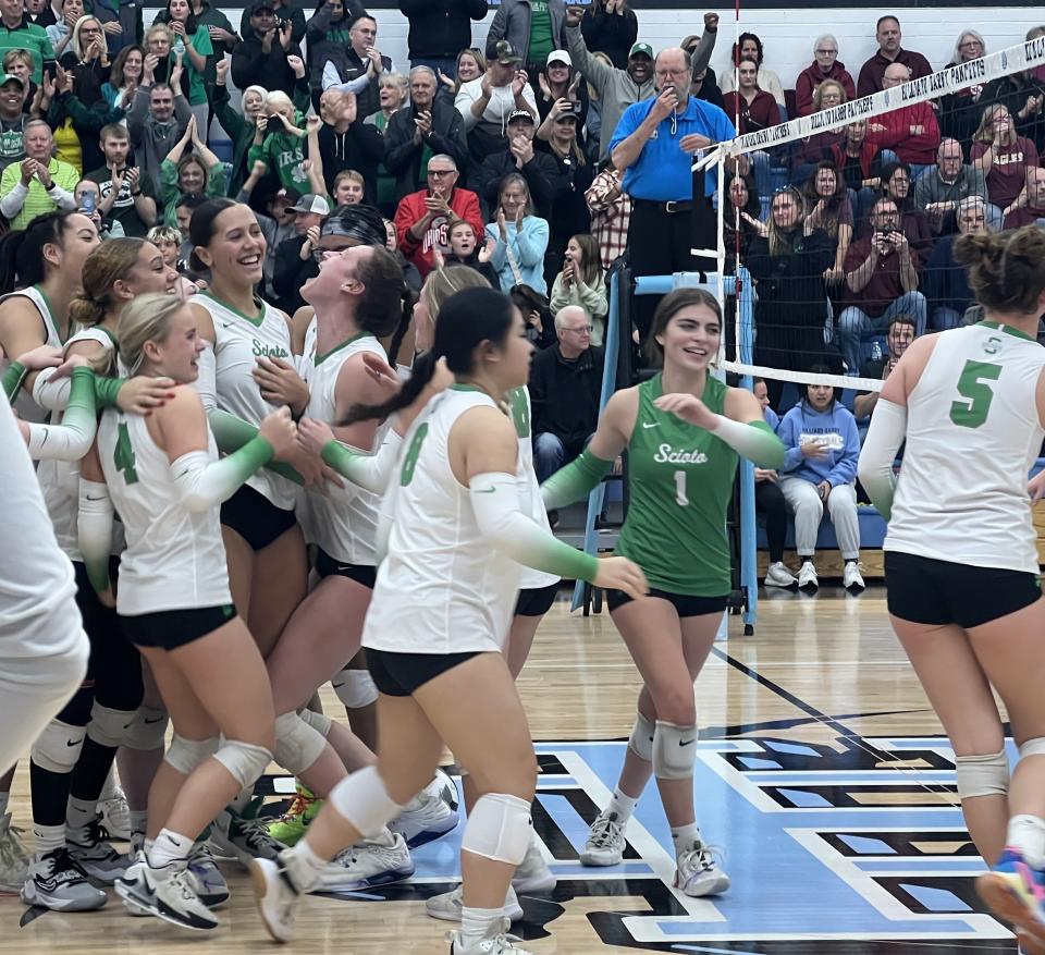 Dublin Scioto celebrates its Division I regional semifinal win Thursday night.