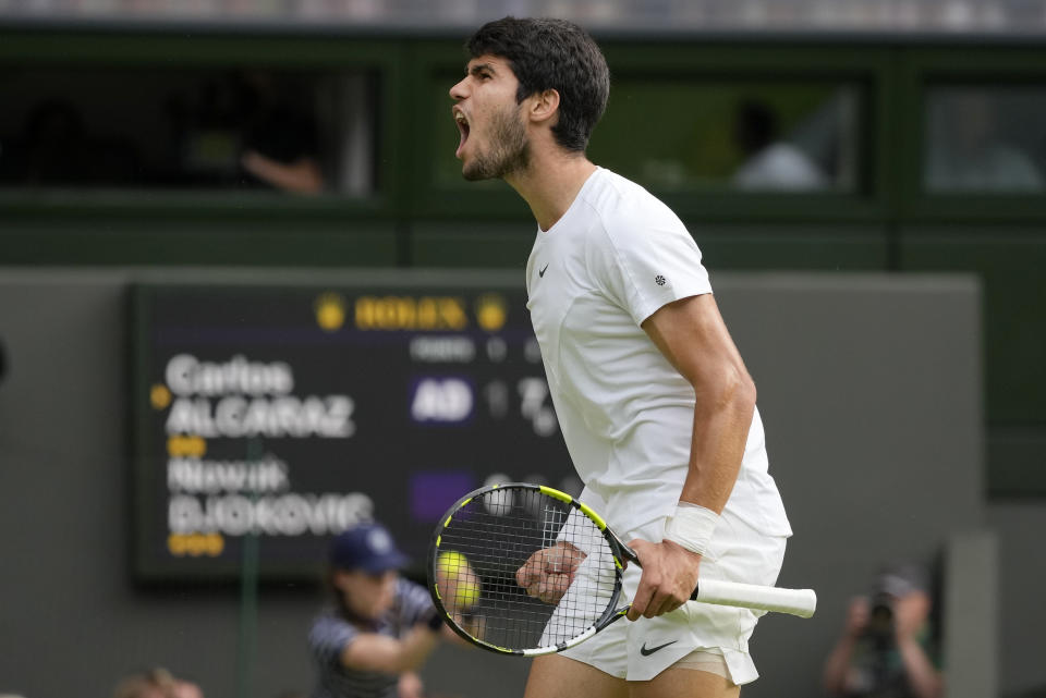 Spain's Carlos Alcaraz celebrates after winning a point against Serbia's Novak Djokovic in the final of the men's singles on day fourteen of the Wimbledon tennis championships in London, Sunday, July 16, 2023. (AP Photo/Kirsty Wigglesworth)