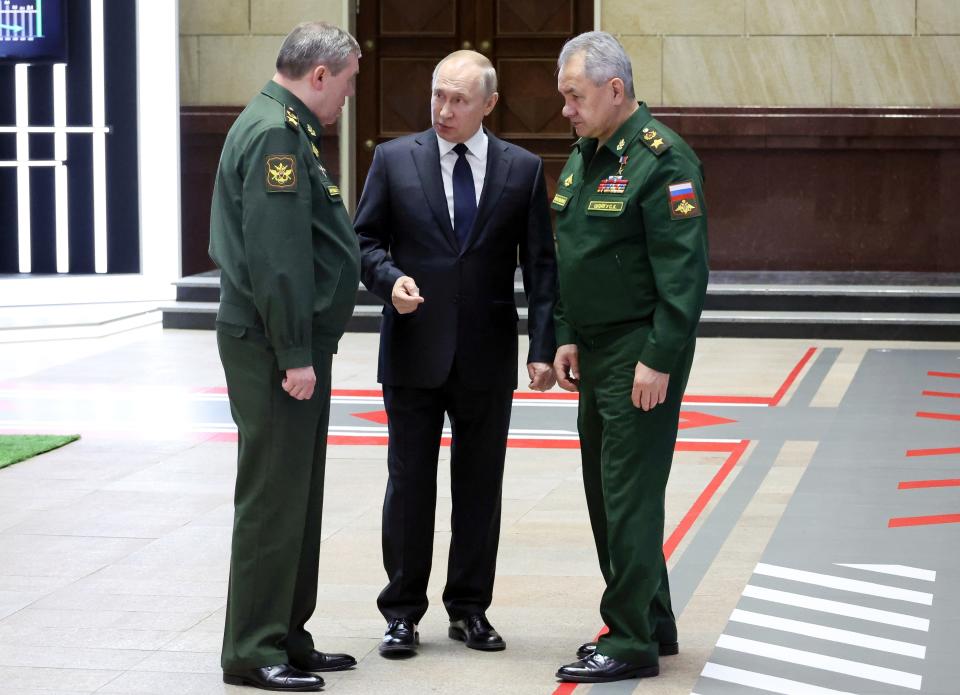 FILE - Russian President Vladimir Putin, center, speaks with Chief of the General Staff Gen. Valery Gerasimov, left, and Russian Defense Minister Sergei Shoigu, after a meeting with senior military officers in Moscow, Russia, Wednesday, Dec. 21, 2022. Russia’s rebellious mercenary chief Yevgeny Prigozhin walked free from prosecution for his June 24 armed mutiny, and it’s still unclear if anyone will face any charges in the brief uprising against the military or for the deaths of the soldiers killed in it. (Mikhail Klimentyev, Sputnik, Kremlin Pool Photo via AP, File)