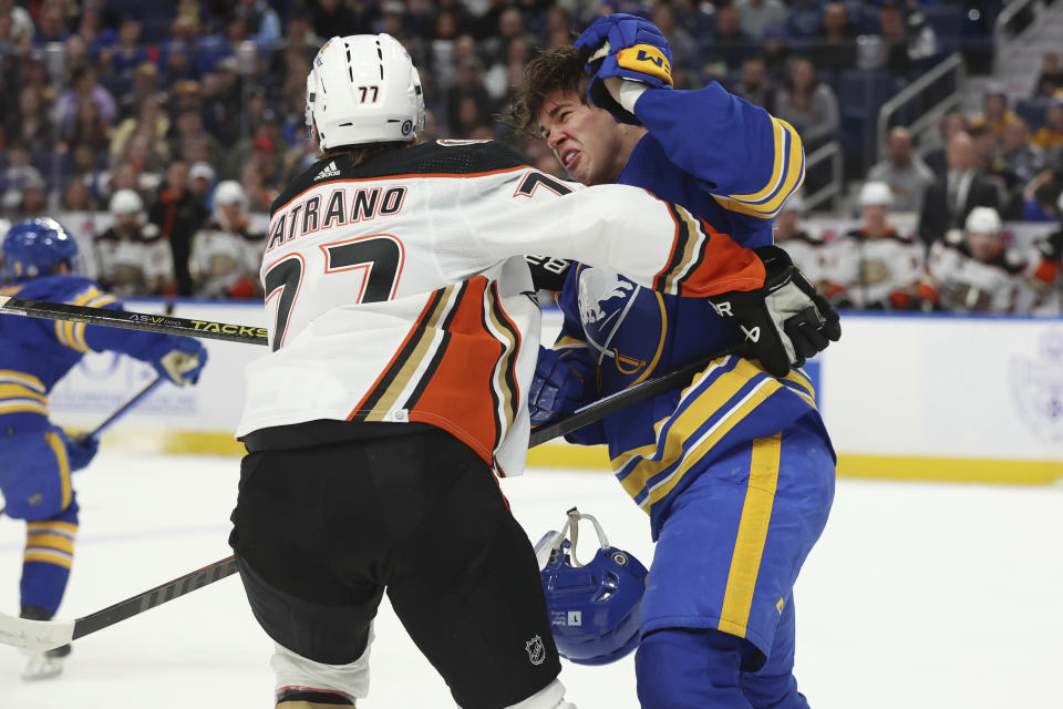 Buffalo Sabres right wing JJ Peterka (77) reacts after being held by Anaheim Ducks right wing Frank Vatrano (77) during the first period of an NHL hockey game Monday, Feb. 19, 2024, in Buffalo, N.Y. (AP Photo/Jeffrey T. Barnes)