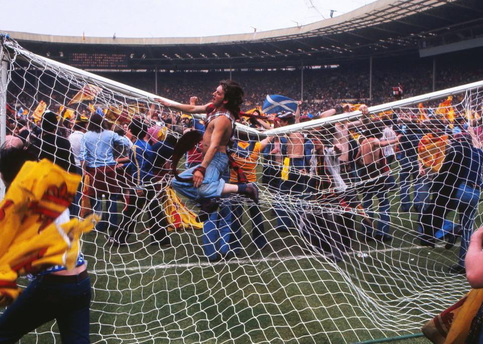 Scotland fans bring down the goalpost during the pitch invasion after the game at Wembley Scotland's victory ensured the won the championship for the second consecutive year - Colorsport/REX