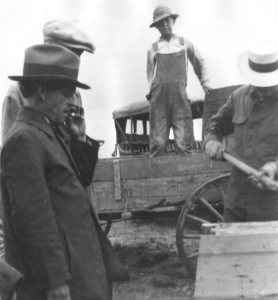 Author/poet John Neihardt, left, supervises the final construction of a concrete monument erected in 1923 to commemorate the heroics of mountain man Hugh Glass, who crawled miles after being left for dead after a grizzly bear mauling. (Courtesy of Joseph Weixelman and University of Missouri)