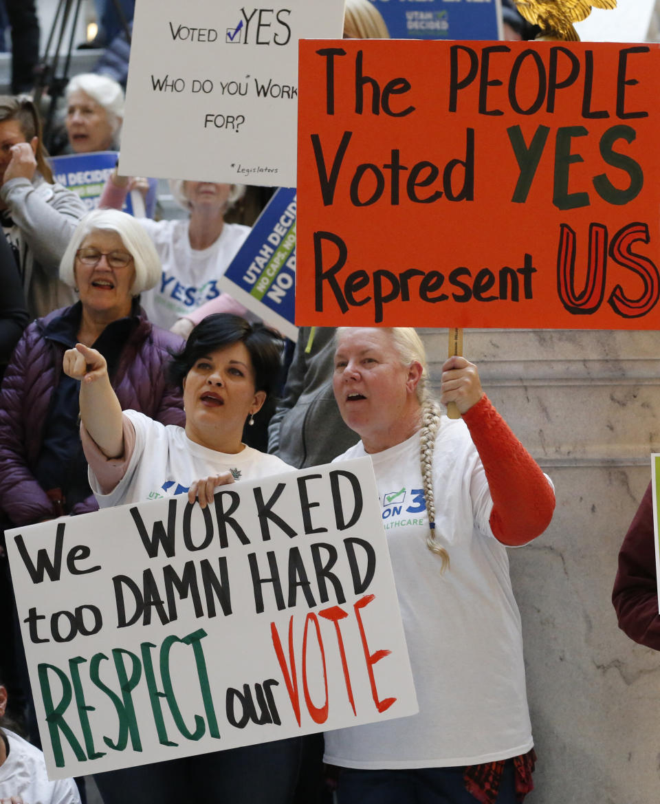 Tiffiny Malo, left, and Pam Harrison, supporters of a voter-approved measure to fully expand Medicaid, at a rally to ask lawmakers not to change the law during the first day of the Utah Legislature on Monday. (Photo: Rick Bowmer/Associated Press)