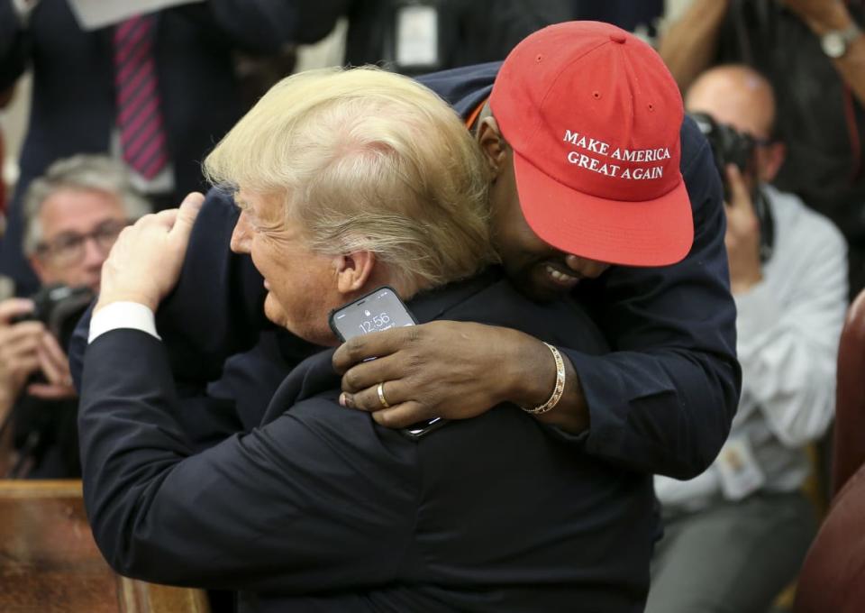 <div class="inline-image__caption"><p>President Donald Trump hugs rapper Kanye West during a meeting in the Oval office of the White House on October 11, 2018, in Washington, D.C. </p></div> <div class="inline-image__credit">Oliver Contreras/Getty</div>