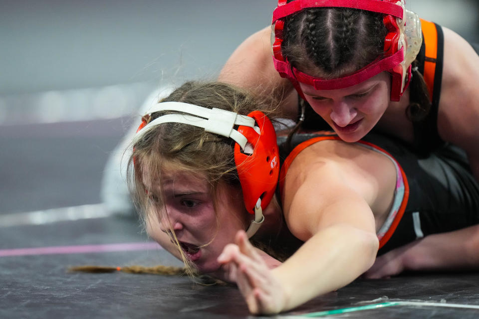 Ames’s Greta Goodman wrestles North Central Trailblazers’s Mariah Michels at 100 pounds in the quarterfinals of the IGHSAU State Girls Wrestling Tournament.