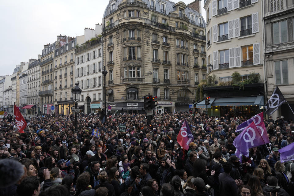 People demonstrate after French President Emmanuel Macron tried to diffuse tensions in a televised address to the nation, Monday, April 17, 2023 in Paris. Emmanuel Macron said Monday that he heard people's anger over raising the retirement age from 62 to 64, but insisted that it was needed. In an televised address to the nation, Macron said "this changes were needed to guarantee everyone's pension," after he enacted the pension law on Saturday. (AP Photo/Thibault Camus)