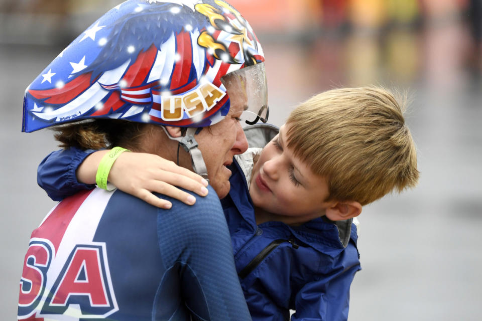 <p>Kristin Armstrong hugs five-year-old son Lucas Armstrong Savola after winning the gold medal in the women’s road cycling individual time trial.</p>