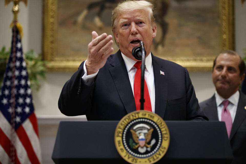 President Donald Trump, accompanied by Health and Human Services Secretary Alex Azar, speaks in the Roosevelt Room of the White House, Wednesday, Sept. 4, 2019, in Washington, as he   announces state opioid response grants. (AP Photo/Alex Brandon)