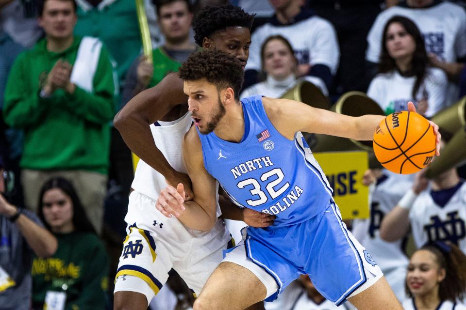 North Carolina's Pete Nance works against Notre Dame's Trey Wertz on Feb. 22 in South Bend, Ind.