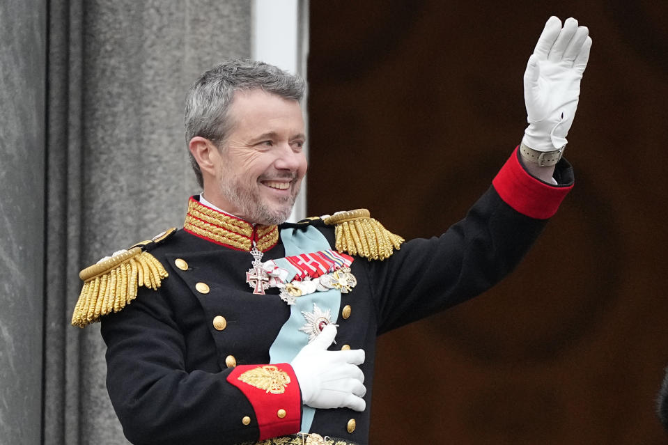 Denmark's King Frederik X waves from the balcony of Christiansborg Palace in Copenhagen, Denmark, Sunday, Jan. 14, 2024. Queen Margrethe II has become Denmark's first monarch to abdicate in nearly 900 years when she handed over the throne to her son, who has become King Frederik X. (AP Photo/Martin Meissner)