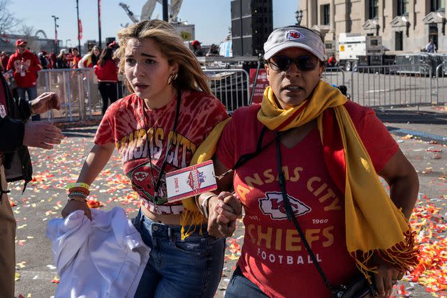 <p>ANDREW CABALLERO-REYNOLDS/AFP via Getty </p> People flee after shots were fired near the Kansas City Chiefs' Super Bowl LVIII victory parade on February 14, 2024, in Kansas City, Missouri. A shooting incident at a packed parade Wednesday to celebrate the Kansas City Chiefs' Super Bowl victory killed one person and injured 21 others, police said