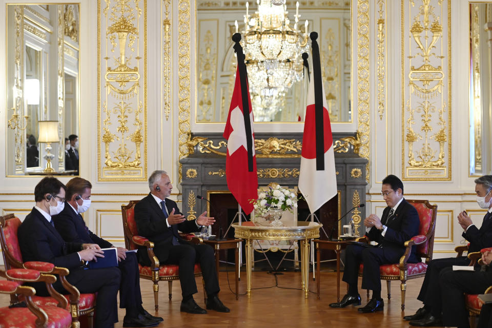 Former President of Switzerland Mr. Didier Burkhalter, left, meets with Japan's Prime Minister Fumio Kishida prior to their bilateral meeting at the Akasaka Palace State Guest House in Tokyo, Japan, Sept. 26, 2022. (David Mareuil/Pool Photo via AP)