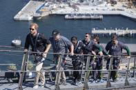 CAPTION CORRECTS THE DATE - Britain's Prince Harry, left, Australia's Prime Minister Scott Morrison, second from left, and Invictus Games representatives climb the Sydney Harbour Bridge in Sydney, Friday, Oct. 19, 2018. Prince Harry and his wife Meghan are on day four of their 16-day tour of Australia and the South Pacific. (AP Photo/Steve Christo, Pool)