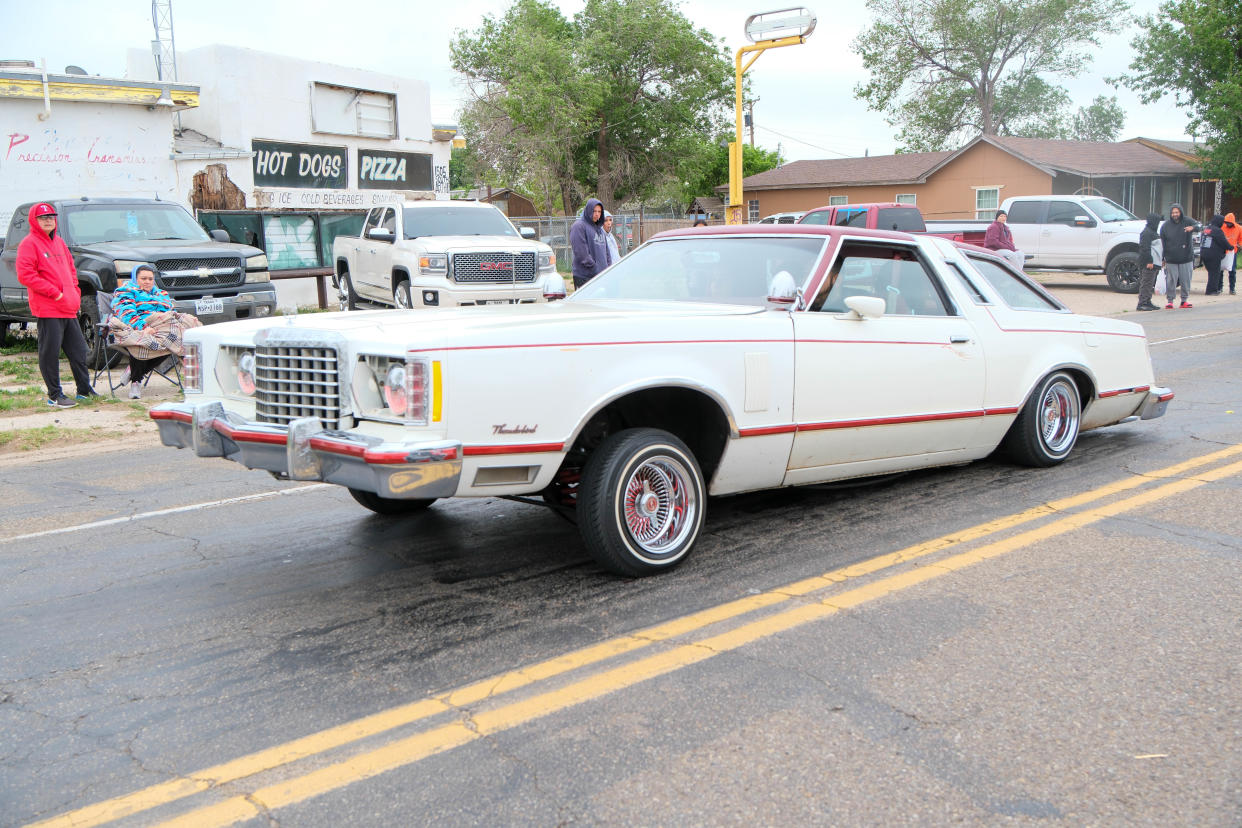 A classic Ford Thunderbird rides past the crowd Saturday at the annual Cinco de Mayo Parade in Amarillo.