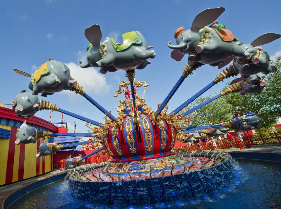 In this May 12, 2012 photo released by Disney theme parks, people ride the "Dumbo the Flying Elephant," attraction in the new Storybook Circus area of Fantasyland at Magic Kingdom Park in Lake Buena Vista, Fla. The renovation and new construction at Fantasyland inside the Magic Kingdom in Florida is the largest expansion project in the park’s 40-year history, doubling the size of the current Fantasyland. (AP Photo/Disney, Gene Duncan)