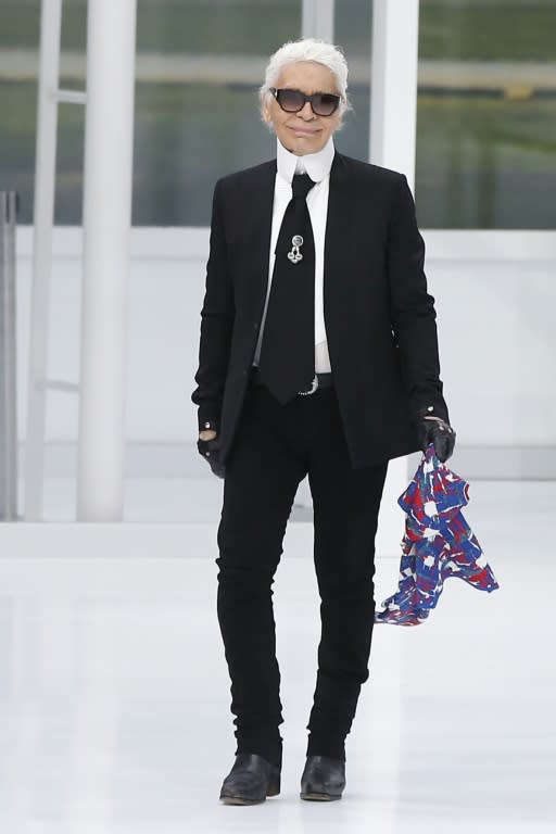 German fashion designer Karl Lagerfeld acknowledges the public at the end of the Chanel 2016 Spring/Summer ready-to-wear collection fashion show, on October 6, 2015 at the Grand Palais in Paris