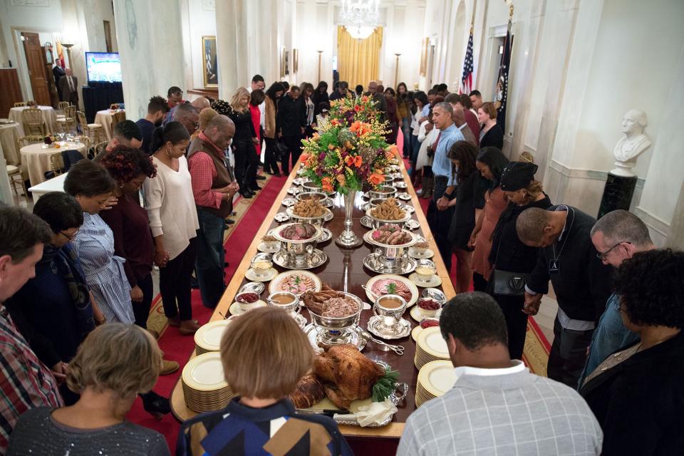 “President Obama leads a prayer before hosting Thanksgiving dinner [in 2016] for family and friends on the State Floor of the White House.” (Photo: Official White House Photo by Pete Souza)
