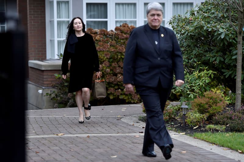 FILE PHOTO: Huawei Technologies Chief Financial Officer Meng Wanzhou leaves her home to attend a court hearing in Vancouver