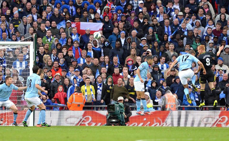 Wigan Athletic's Ben Watson (far right) scores the winning goal