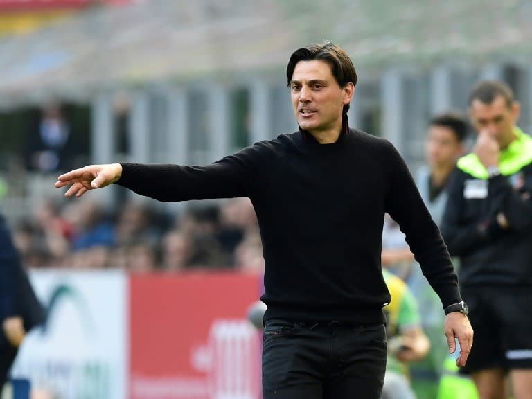 AC Milan's coach Vincenzo Montella follows the action during their Italian Serie A match against Palermo, at the San Siro stadium in Milan, on April 9, 2017