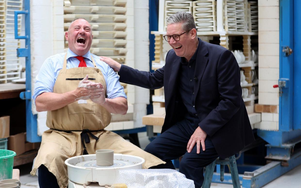 Sir Keir Starmer shares a joke with Keith Brymer Jones at a Staffordshire pottery factory