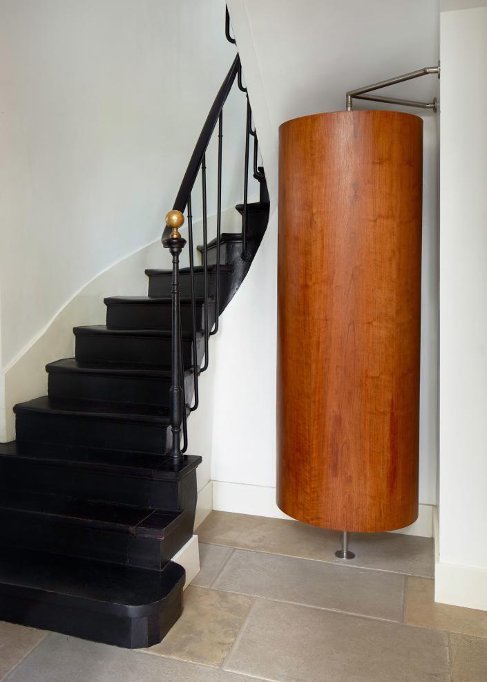 The front door opens onto a small entrance and the main staircase. A round closet serves as a coat closet, whose maker is unknown.