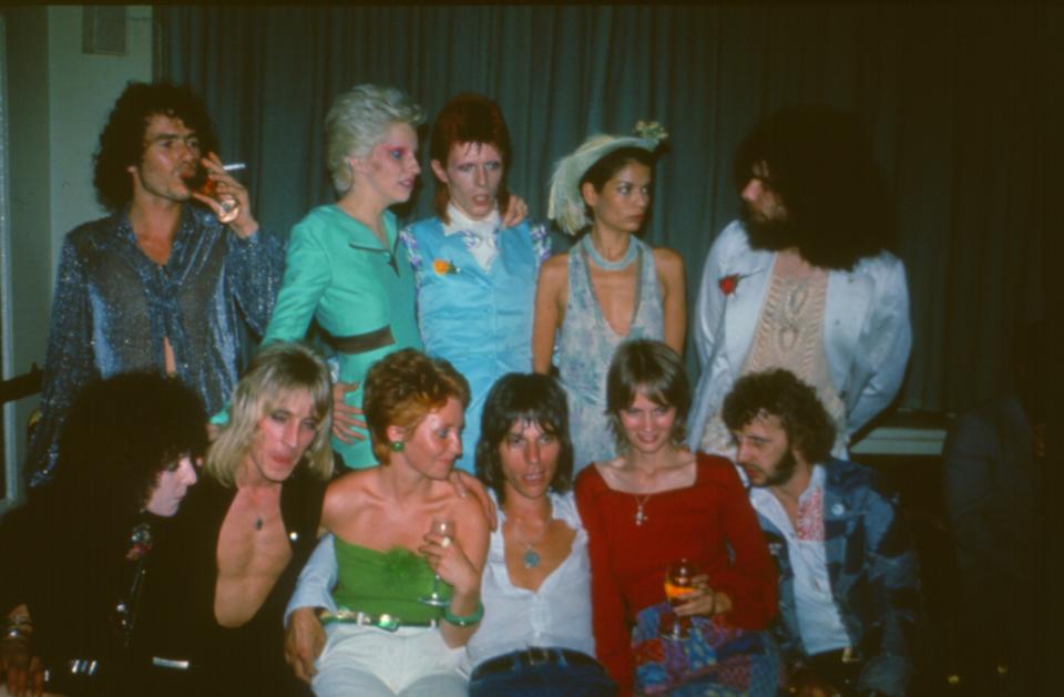 Party following David Bowie's Ziggy Stardust retirment concert, Cafe Royal, London, 4th July 1973. L-R (back) unknown, Angie Bowie, David Bowie, Bianca Jagger, Edgar Broughton, (front) Maureen Starkey, Mick Ronson, Lulu, Jeff Beck, Celia Hammond, Ringo Starr. (Photo by Mark and Colleen Hayward/Getty Images)