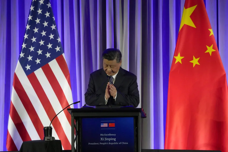 China's President Xi Jinping claps as he speaks at a dinner with business leaders during the Asia-Pacific Economic Cooperation (APEC) conference Wednesday, Nov. 15, 2023, in San Francisco. (AP Photo/Jeff Chiu)