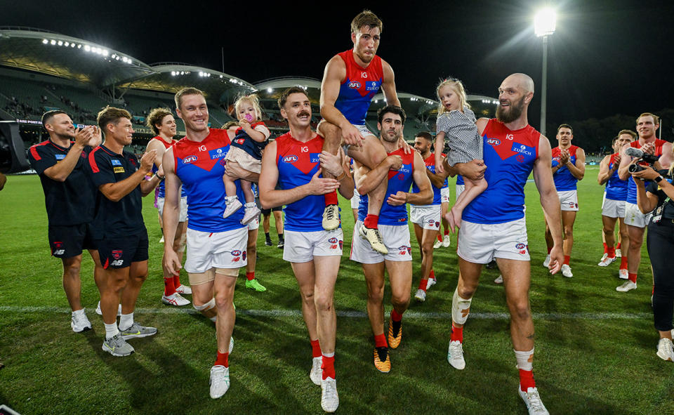 Jake Lever and Christian Petracca with Melbourne Demons teammates.