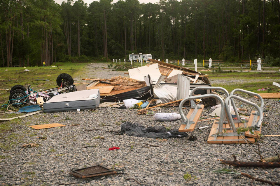 Debris covers the ground after a tornado struck Wednesday, the on-base RV park on Naval Submarine Base Kings Bay on Thursday, July 8, 2021 in Kings Gay, Ga. Severe weather from Tropical Storm Elsa spurred tornado warnings in Delaware and New Jersey early Friday as the system moved over the mid-Atlantic states and into the northeastern United States. (Mass Communication 3rd Class Aaron Xavier Saldana/U.S. Navy via AP)