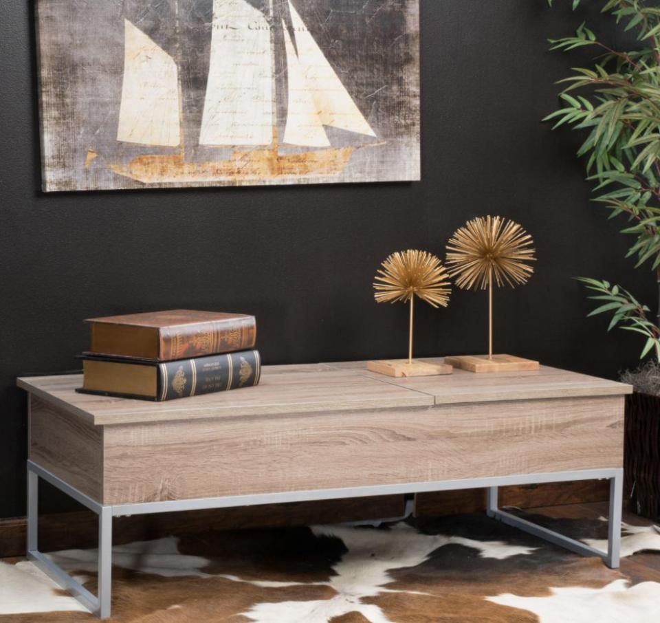 Not only does this coffee table look modern and minimalist, it offers much more space, too. Lift up the top and find two trays that you can pull out for whenever, like when you want to work from your laptop on the couch. <a href="https://fave.co/35pAJac" target="_blank" rel="noopener noreferrer">Originally $279, get it now for $230 at The Home Depot</a>.