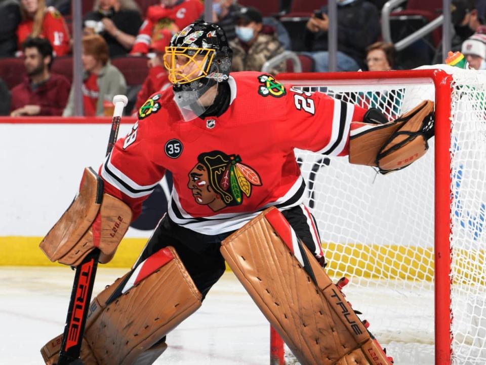 Chicago's Marc-Andre Fleury wears the Ojibway-inspired mask from Red Lake, Ont., artist Patrick Hunter during a recent game against the Pittsburgh Penguins. It was designed for Native American Heritage Month. (Chicago's NHL team/Twitter  - image credit)