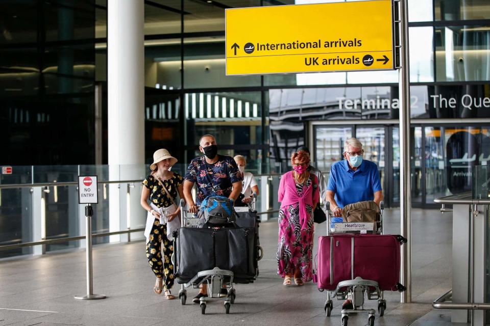 Travellers exit Heathrow Airport Terminal 2 in August. It comes as coronavirus cases rise in Portugal (Getty Images)