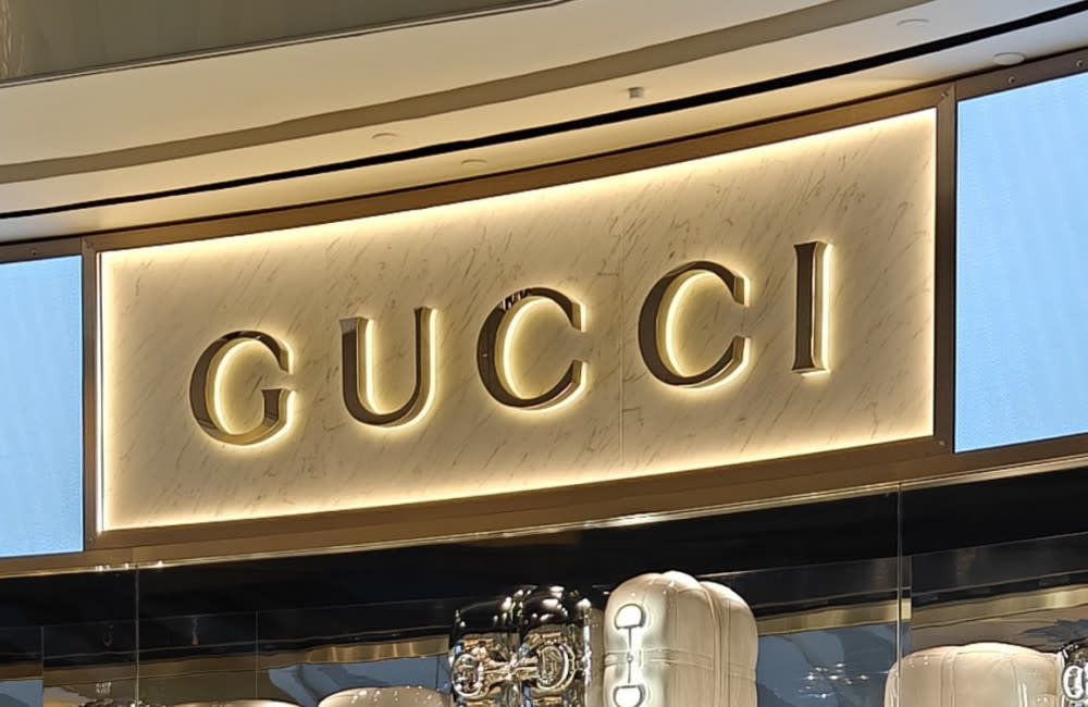 Scores of Gucci employees have mounted a historic strike in protest against plans to relocate a huge part of its design studio team from Rome to Milan credit:Bang Showbiz