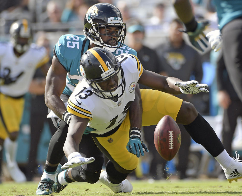 Jacksonville Jaguars defensive back D.J. Hayden (25) breaks up a pass intended for Pittsburgh Steelers wide receiver James Washington (13) during the first half of an NFL football game, Sunday, Nov. 18, 2018, in Jacksonville, Fla. (AP Photo/Phelan M. Ebenhack)