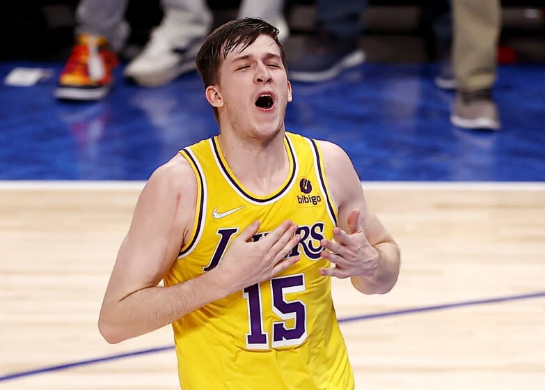 DALLAS, TEXAS - DECEMBER 15: Austin Reaves #15 of the Los Angeles Lakers reacts after shooting the game-winning shot against Tim Hardaway Jr. #11 of the Dallas Mavericks in overtime at American Airlines Center on December 15, 2021 in Dallas, Texas. (Photo by Tom Pennington/Getty Images)