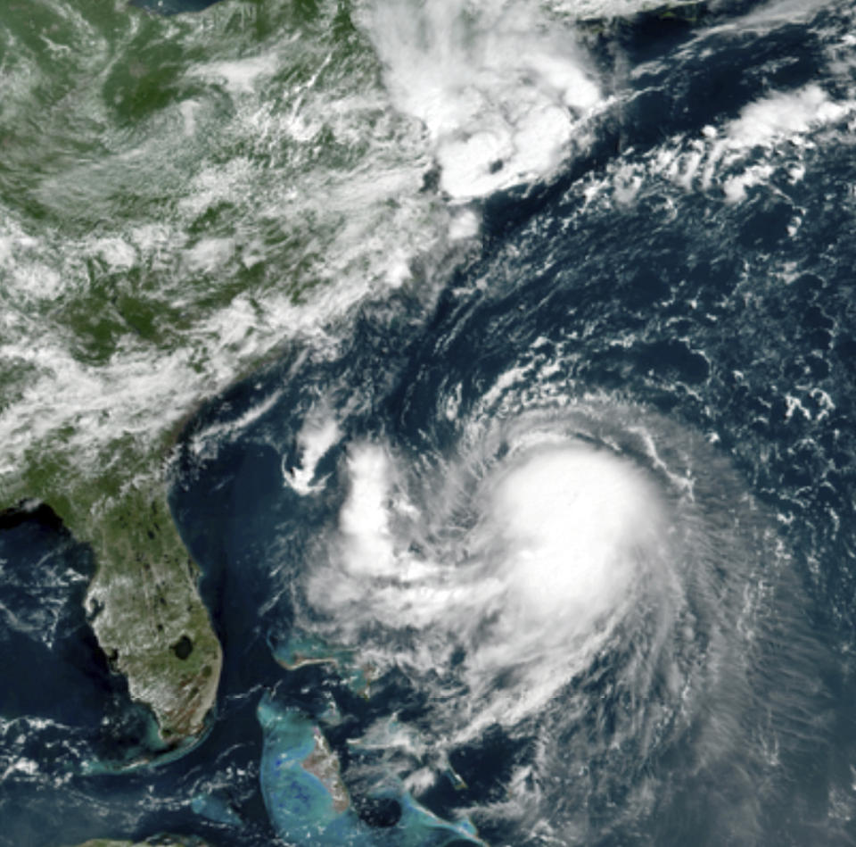 This GOES-16 East GeoColor satellite image taken Friday, Aug. 20, 2021, at 11:40 a.m. EDT., and provided by NOAA, shows Tropical Storm Henri in the Atlantic Ocean. Henri was expected to intensify into a hurricane by Saturday, the U.S. National Hurricane Center said. Impacts could be felt in New England states by Sunday, including on Cape Cod, which is teeming with tens of thousands of summer tourists. (NOAA via AP)