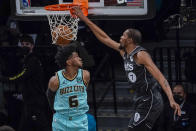 Brooklyn Nets forward Kevin Durant (7) goes to the basket past Charlotte Hornets forward Jalen McDaniels (6) during the second half of an NBA basketball game Friday, April 16, 2021, in New York. (AP Photo/Mary Altaffer)