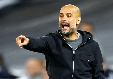 Soccer Football - Champions League - Feyenoord vs Manchester City - De Kuip, Rotterdam, Netherlands - September 13, 2017 Manchester City manager Pep Guardiola gestures REUTERS/Michael Kooren