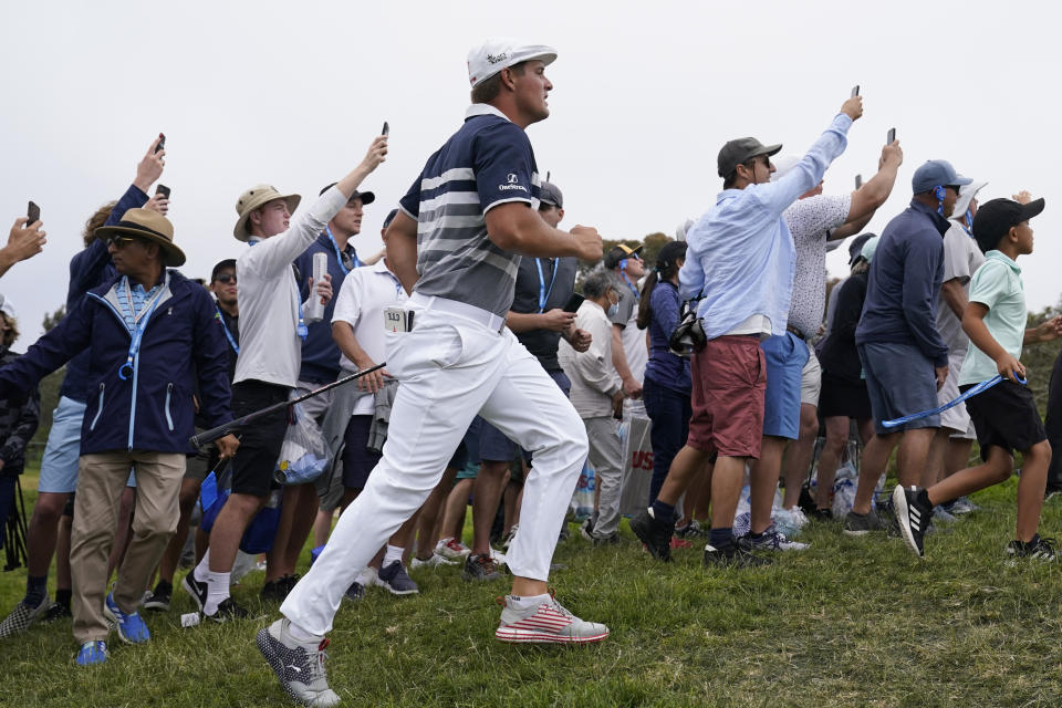 Bryson DeChambeau hurries to see his shot after hitting from the 11th fairway rough during the final round of the U.S. Open Golf Championship, Sunday, June 20, 2021, at Torrey Pines Golf Course in San Diego. (AP Photo/Marcio Jose Sanchez)
