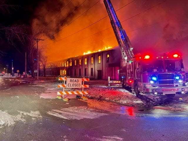 Springfield fire fighters fight a blaze at a former Goodwill building on North 11th Street Saturday, Dec. 24, 2022.