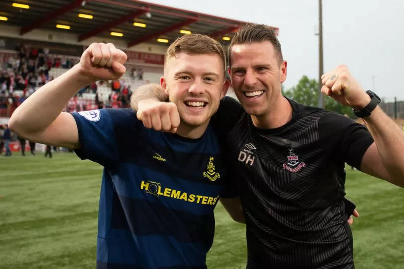 Goalkeeper coach David Hutton (right) is staying on in his dug-out role