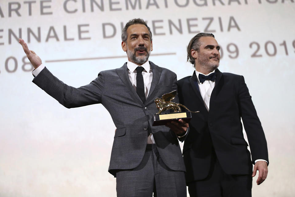 Director Todd Phillips, left, holds the Golden Lion for Best Film for 'Joker', joined by lead actor Joaquin Phoenix at the closing ceremony of the 76th edition of the Venice Film Festival, Venice, Italy, Saturday, Sept. 7, 2019. (Photo by Joel C Ryan/Invision/AP)