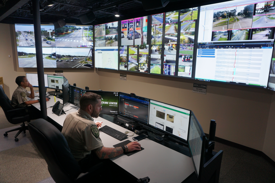 Lafayette Parish Sheriff's Cpl. Jean Paul Auzenne, left, and Deputy Dustin Roger work in the  Real Time Crime Center, which is designed to expand the sheriff's office's capabilities when responding to crime.