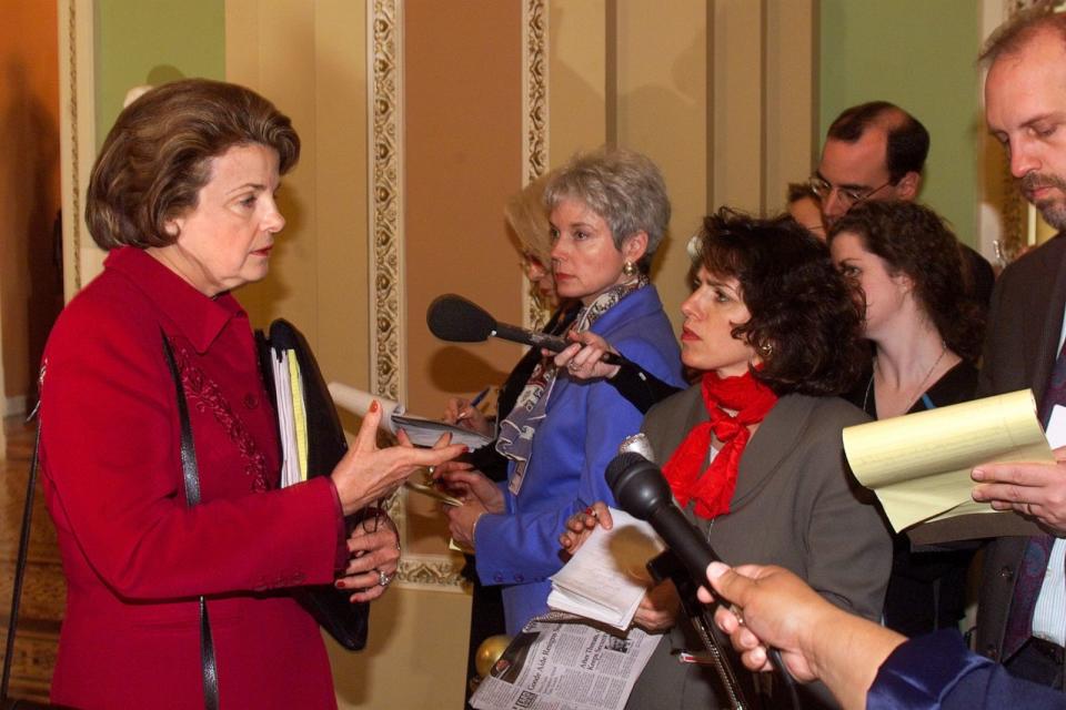 PHOTO: Senator Dianne Feinstein (D-CA) speaks with reporters outside the Senate on Jan. 21, 1999, during the sixth day of Senate impeachment trial proceedings against President Bill Clinton. (Luke Frazza/AFP via Getty Images, FILE)