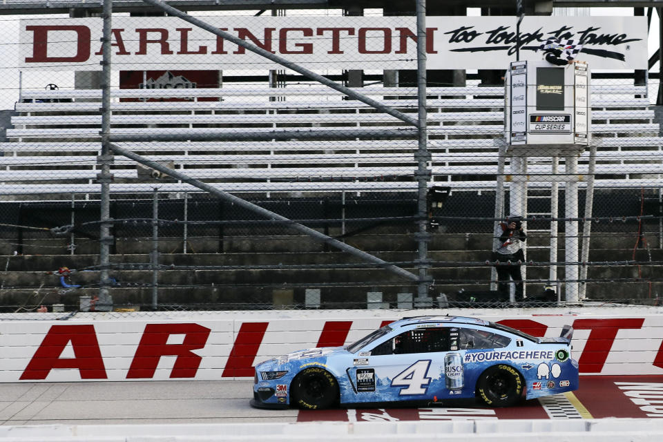 Kevin Harvick (4) crosses the finish line to win the NASCAR Cup Series auto race Sunday, May 17, 2020, in Darlington, S.C. (AP Photo/Brynn Anderson)