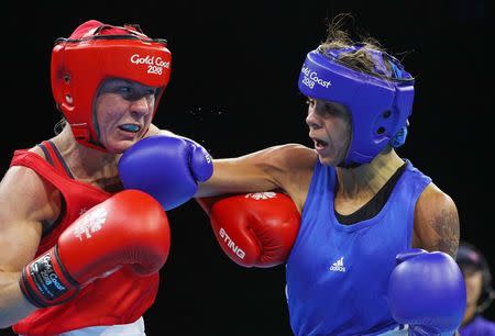 Boxing - Gold Coast 2018 Commonwealth Games - Women's 51kg Final Bout - Oxenford Studios - Gold Coast, Australia - April 14, 2018. Lisa Whiteside of England (red) v Carly McNaul of Northern Ireland (blue). REUTERS/Athit Perawongmetha